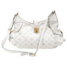 Louis Vuitton White leather "Mahina” large shoulder bag featuring an all-over leather "Mahina" logo pattern, gold-tone hardware, adjustable shoulder strap, a top zip opening, an inside brown suede leather, and an inside logo plaque. Circa: 2000s Length at bottom: 15.7in (40cm) Height: 9.5in. (24cm) Bottom width:5.1in. (13cm) Shoulder strap length: 36.2 in. (92cm) In good vintage condition. Made in France. We guarantee you will receive this gorgeous item as described and showed on photos. Louis Vuitton Store, Black Leather Clutch, White Shoulder Bag, Large Shoulder Bags, Vintage Louis Vuitton, Leather Clutch Bags, Louis Vuitton Shoulder Bag, Purple Leather, Navy Leather