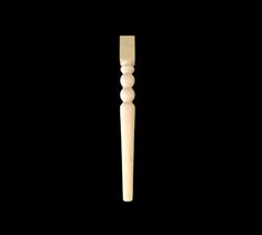 a white wooden pole on a black background