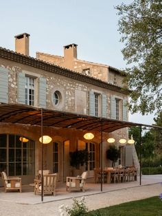 an outdoor dining area with tables and chairs