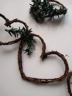 two heart shaped planters sitting on top of a white table next to each other