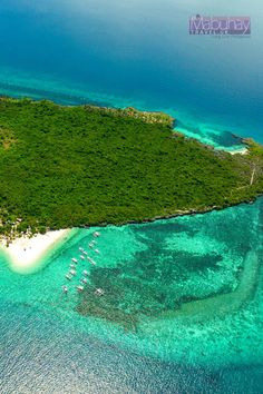 an island with several boats in the water