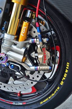 the brake assembly is attached to the motorcycle's front wheel and rear axles