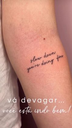 a person with a tattoo on their arm that says, dear dawn you're dying