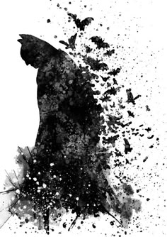 a black and white photo of a batman silhouette with splatters on the background