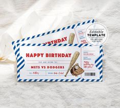 two baseball ticket cards sitting on top of a white sheet with blue and red stripes