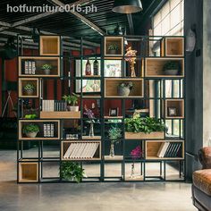 a room filled with lots of shelves and plants