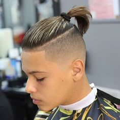 Hawk Haircut, Undercut Men Back View, Mens Haircut Long On Top Short On Sides High Fade, Man Bun Shaved Sides Undercut, Mens Haircut Faded Sides Long On Top, Undercut Ponytail Male, Boys Haircut Long On Top Shaved Sides, Boys Hairstyles Long On Top Shaved Sides, Shaved Side Long Top Mens Hair