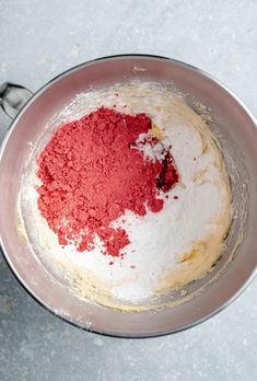 a red and white mixture in a silver bowl