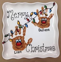 a plate with two handprints on it that says merry guliana and llama