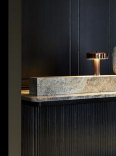 a man sitting at a bar with his feet up on the counter next to him