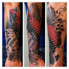 this is an image of a man's arm with a koi fish tattoo on it