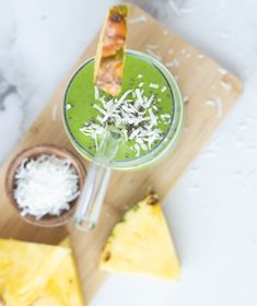 a green smoothie with pineapple and shredded cheese