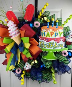 a colorful birthday wreath on the front door