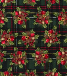 a plaid christmas fabric with holly, bells and pine cones on the front in green and red