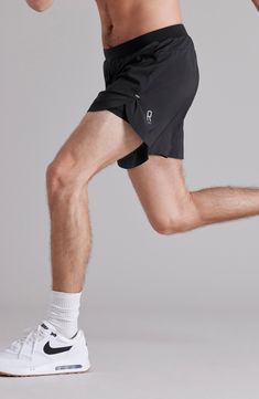 Lightweight and stretchy, these running shorts made with recycled fibers feature an odor-fighting compression layer and open sides for easier range of motion. A secure pocket for small essentials and a loop to hold a T-shirt allow you to enjoy hands-free, distraction-free runs. 5" inseam; 26" leg opening; 13" front rise; 114 1/2" back rise (size Medium) Elastic waist with internal drawcord Back zip pocket; T-shirt loop Interior compression shorts GoldFusion™ antimicrobial technology with gold na Stretch Athletic Shorts With Short Legs, Stretch Functional Athletic Shorts, Stretch Functional Athletic Shorts With Short Legs, Running Athletic Shorts With 4-way Stretch And Built-in Shorts, Functional Athletic Shorts With 4-way Stretch For Jogging, Functional 4-way Stretch Athletic Shorts For Jogging, Black Stretch Activewear For Running Errands, Activewear With Built-in Shorts And 4-way Stretch For Running, Black Compressive Running Shorts