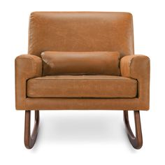 a brown leather chair sitting on top of a white floor next to a wooden frame