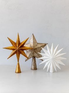 three different types of decorative objects on a white surface