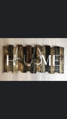 the word home is made out of wood blocks and letters that spell it's love