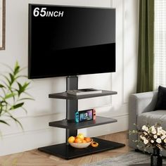 a flat screen tv sitting on top of a black stand