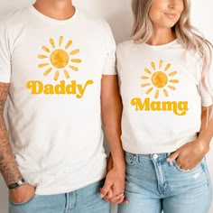 two people wearing matching shirts with the words daddy and mama printed on their chests