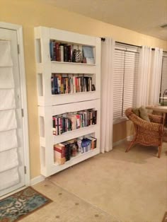 there are many different bookshelves in this room and one is filled with books