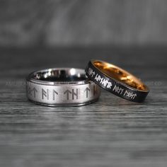 two wedding rings with the names of different people engraved on them