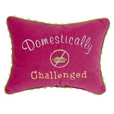 a pink pillow that says domesticly challenged on the front and back with gold trim