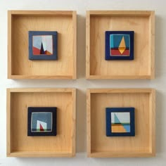 four wooden boxes with different shapes and sizes on the inside one is blue, green, red, yellow, and orange