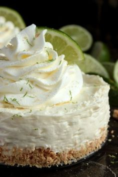 a close up of a cake on a plate with limes