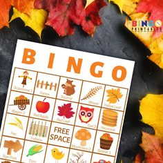 a printable fall bingo game surrounded by autumn leaves