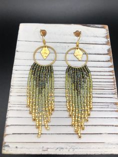 ⋄ Handwoven seed bead fringe earrings made with high quality Japanese Miyuki Delica glass beads ⋄ 100% Brass beading hoop & 100% brass, hammered diamond charm ⋄ gold plated ear wire (nickel free & hypoallergenic)         ⋄ PLEASE DIRECT MESSAGE me with any questions regarding ear wire material, other options ARE available upon request :)  ⋄ Handmade to order ⋄ LENGTH: 3" ⋄ WIDTH: 3/4" ** Please message me if you have any questions or would like to make changes to the original design! I am happy Fringe Earrings Diy, Green Beaded Earrings, Boho Jewelry Bracelet, Boho Beaded Earrings, Seed Bead Fringe Earrings, Bead Fringe Earrings, Bead Fringe, Beaded Fringe Earrings, Jewelry Design Earrings