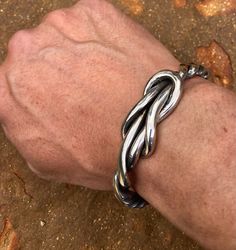 "Custom Viking Knot is all 100% stainless steel! This piece is a Fullheartforge original and is one of the most unique bracelets out there. Also available in a smaller version called the lady viking knot! Custom, hand forged stainless steel bracelet! This material is not made of a high carbon steel that rusts, bends or breaks easily! These bracelets do not leave green or rust marks on the skin and are comfortable to wear continuously. In fact, I have worn mine for 31 years without ever removing Viking Knot, Unique Mens Bracelet, Iron Jewelry, Stainless Bracelet, Bracelet Viking, Viking Designs, Infinity Knot, Viking Bracelet, Viking Jewelry