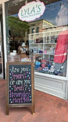 a sign in front of a store that says are you mom? or are you born?