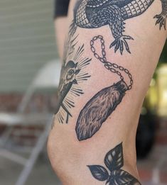 a person with tattoos on their legs and arm