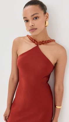 Sleek Sleeveless Halter Top For Party, Elegant Silk Halter Top For Formal Occasions, Elegant Silk Halter Top For Formal Events, Chic Halter Dress With Elastic Neckline For Party, Sleek Halter Neck Top For Evening, Elegant Stretch Backless Halter Top, Multi-way Halter Neck Top For Party, Elegant Stretch Halter Top, Backless, Elegant Silk Halter Top For Party