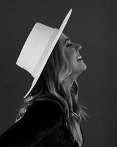 black and white photograph of a woman wearing a hat