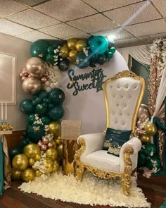 a room decorated with balloons and gold, green, and white furniture in front of a sign that says summit street