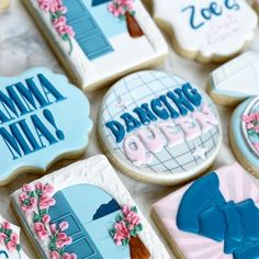 decorated cookies are displayed on a table