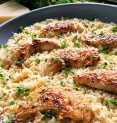 chicken and rice in a skillet with parsley sprinkled on the side