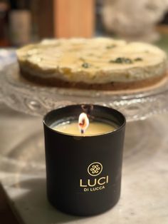 a candle that is sitting in front of a cake