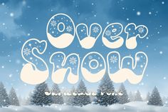 the words over snow are surrounded by trees and snowflakes in front of a blue sky