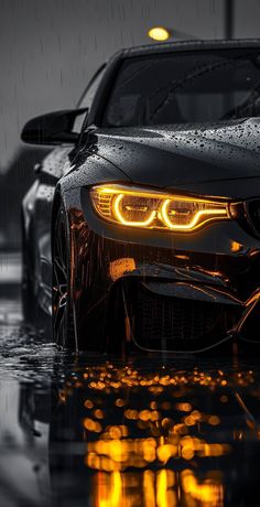 a car is shown in the rain with its lights on