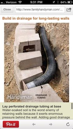 an image of a pipe laying on the ground next to a brick wall that has been built in drainage for long - fasting walls