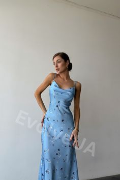 Our blue silk slip dress of midi length is perfect for a party, date and holidays or bachelorette party, as well as for bridesmaids. It's a combination of style, elegance and trends. Dress length is 125cm or 49 1/4 inches. Combines well with various accessories and various types of shoes, including heels and flat-lays. DETAILS - midi silk slip - sleeveless - adjustable shoulder straps - cowl neck MATERIAL Blend of natural silk and polyester SIZES XS = 2 US numeric BUST 33 inches or 84cm WAIST 24 Blue Satin Midi Dress For Spring, Blue Midi Satin Dress For Spring, Blue Satin Midi Dress For Evening, Light Blue Fitted Sleeveless Slip Dress, Blue Satin Midi Slip Dress, Spring Blue Satin Dress With Bias Cut, Summer Sleeveless Slip Dress For Prom, Sleeveless Summer Prom Slip Dress, Sleeveless Slip Dress For Summer Prom