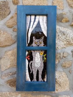 a blue window with a stained glass cat on it's side and the words, i love cats written below