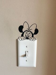 a mickey mouse light switch cover is shown