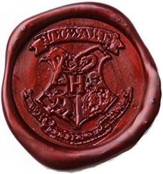 a rubber stamp with the words harry potter and hogwart's crest on it