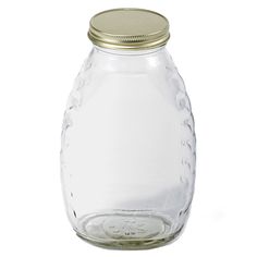 an empty glass jar with a metal lid