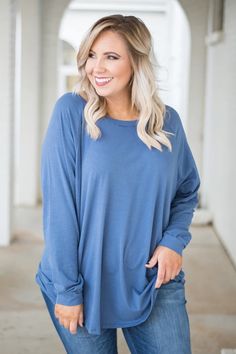 Casual Blue Tops With Batwing Sleeves, Oversized Light Blue Tops For Fall, Oversized Light Blue Top For Fall, Blue Spring Tunic For Loungewear, Blue Relaxed Fit Long Sleeve Top With Crew Neck, Oversized Blue Tunic For Spring, Casual Blue Long Sleeve Top For Layering, Oversized Blue Top For Fall, Blue Casual Tunic With Relaxed Fit