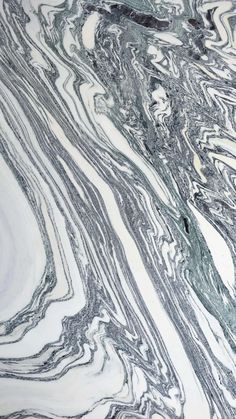 an abstract marbled surface with black and white swirls on the top, as seen from above